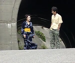 A geisha is tied to a tree and fucked hard out in the forest